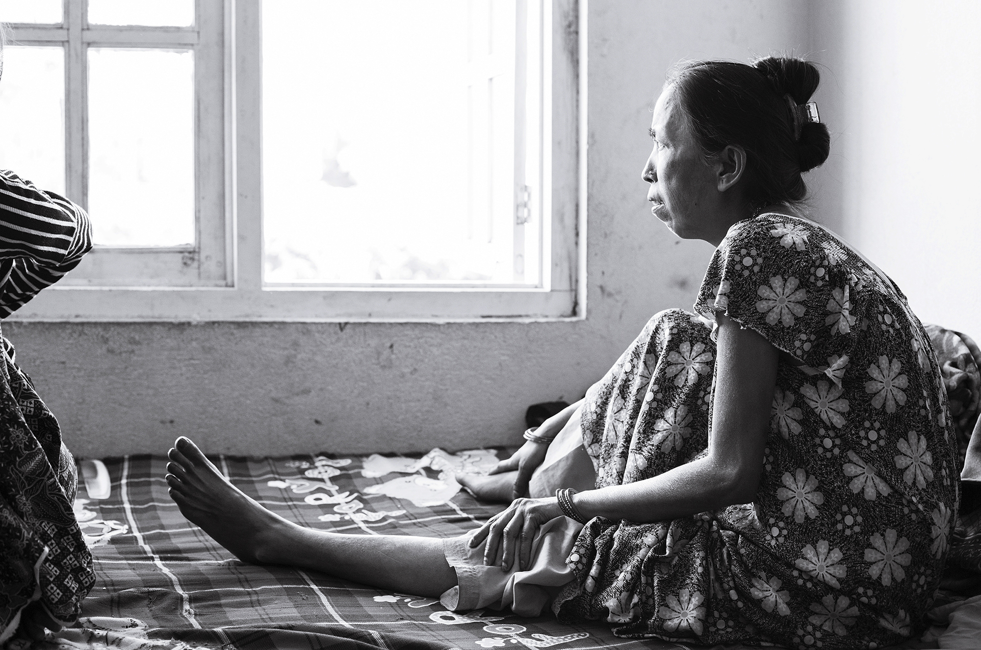 Phoolmaya, Anu's mother, injured her leg in the earthquake when pieces of a stone wall collapsed upon it. A manual labourer, she was unable to work in the year following the injury.