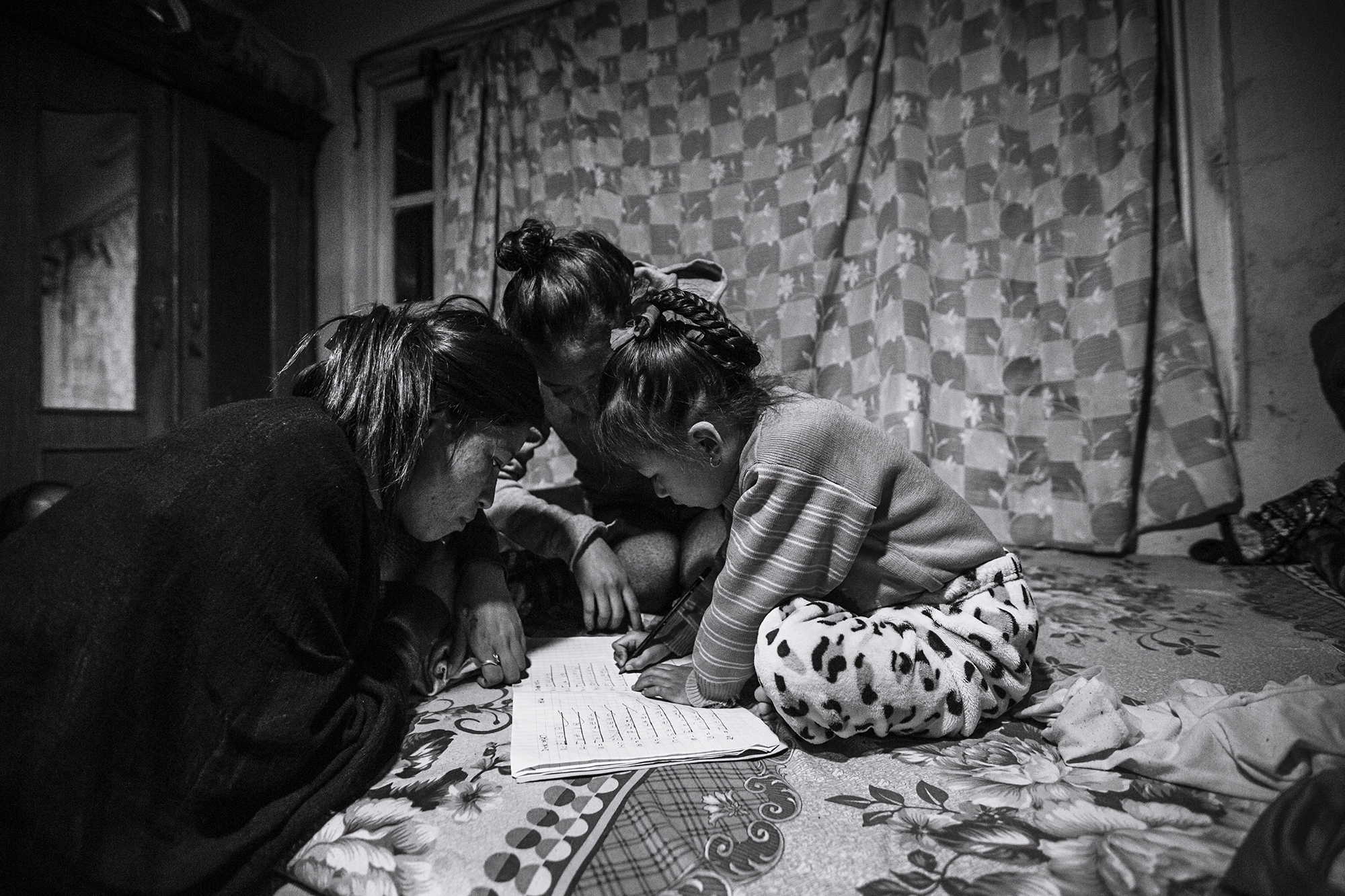  Anu &amp; Anita help Anjika with her schoolwork. 