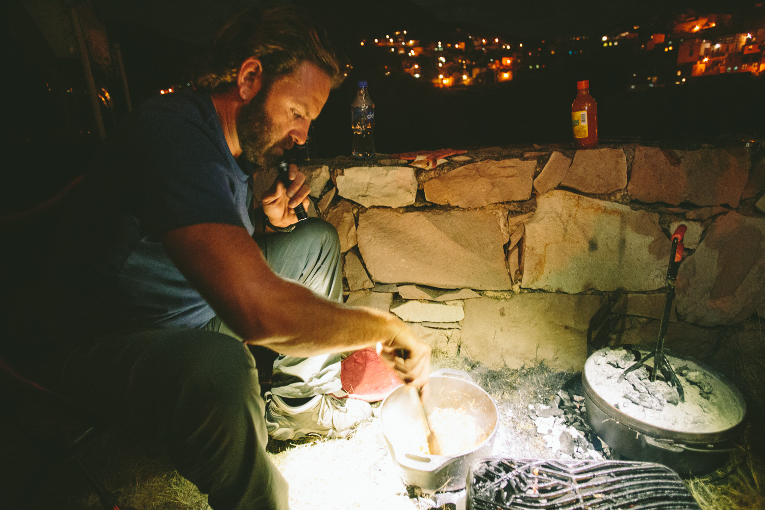 Chris cooking ribs in a dutch oven.
