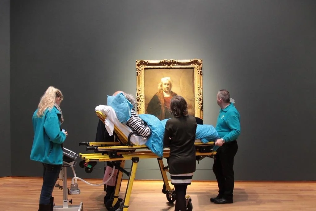 tierradentro : A terminal patient enjoys Rembrandt paintings at the Rijskmuseum, Amsterdam, one final time. Photo credit: unknown.