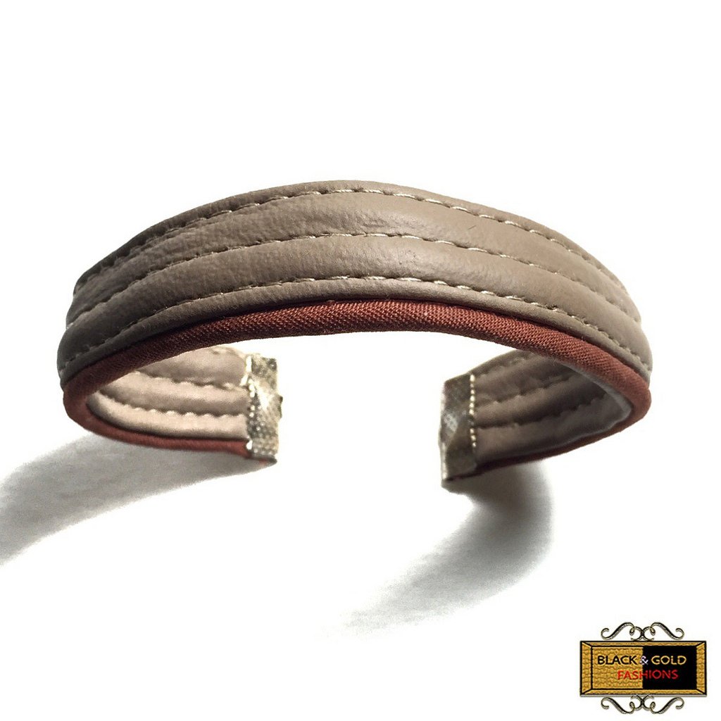 Geneva Cuff Bracelet stands out with its distinct piping design that adds a touch of contrast and intricate detail.