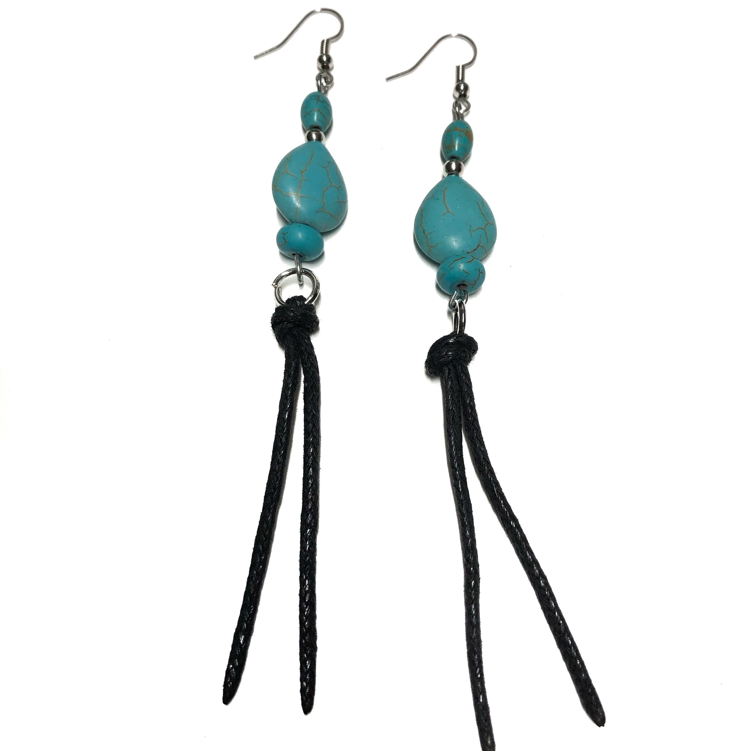 Turquoise teardrop earrings feature a tassel end.