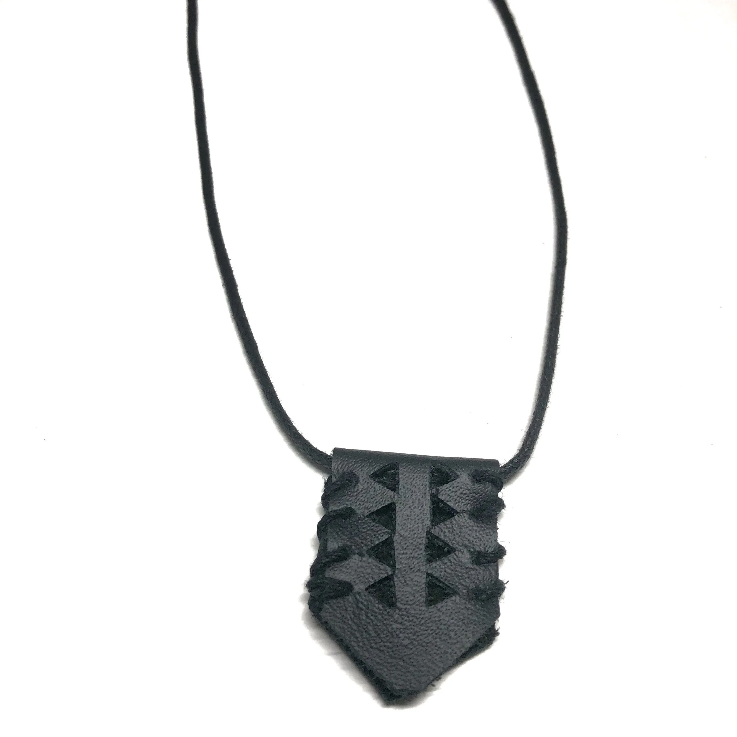 Geometry leather cut-out cord necklace.jpeg
