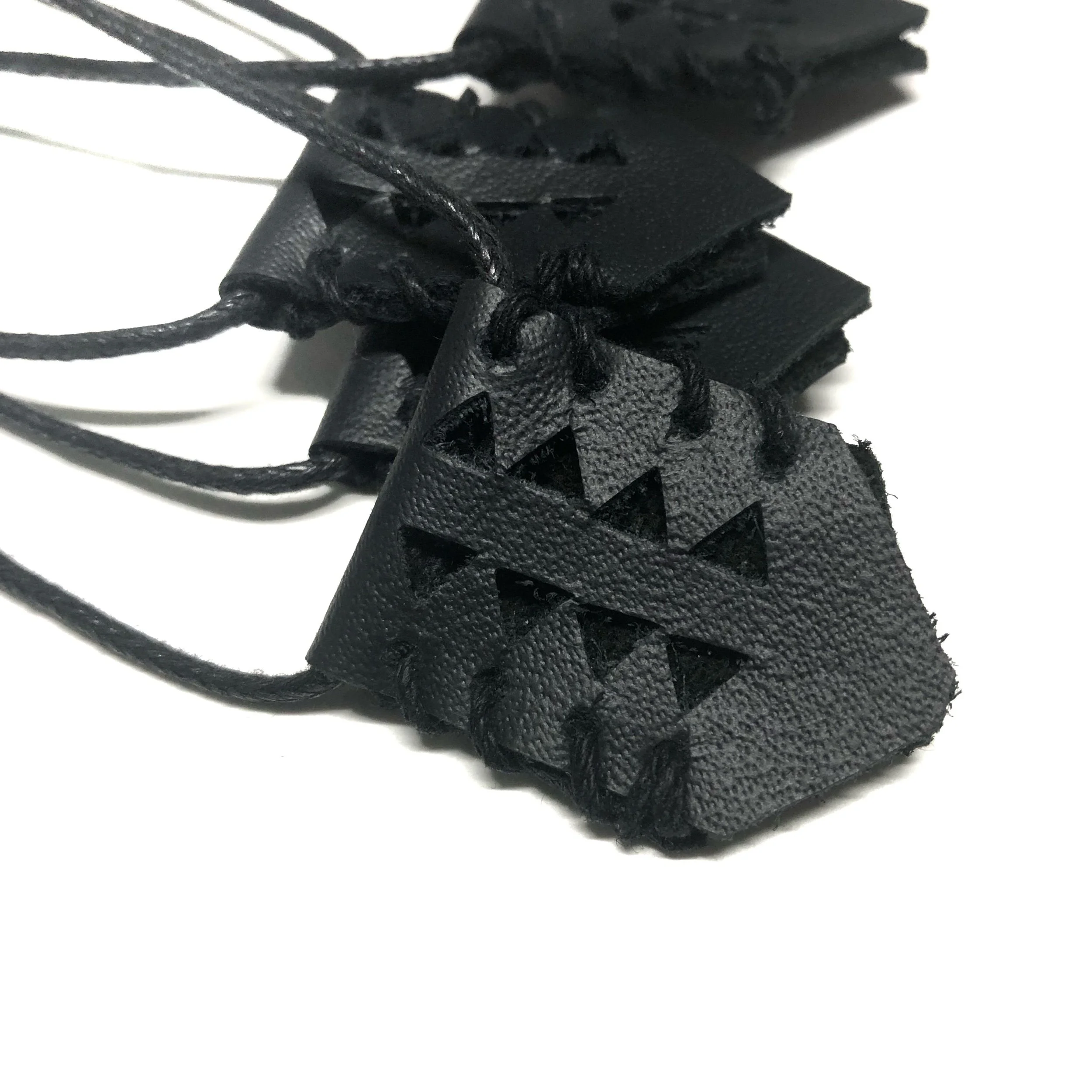 Geometry leather cut-out cord necklace.jpeg