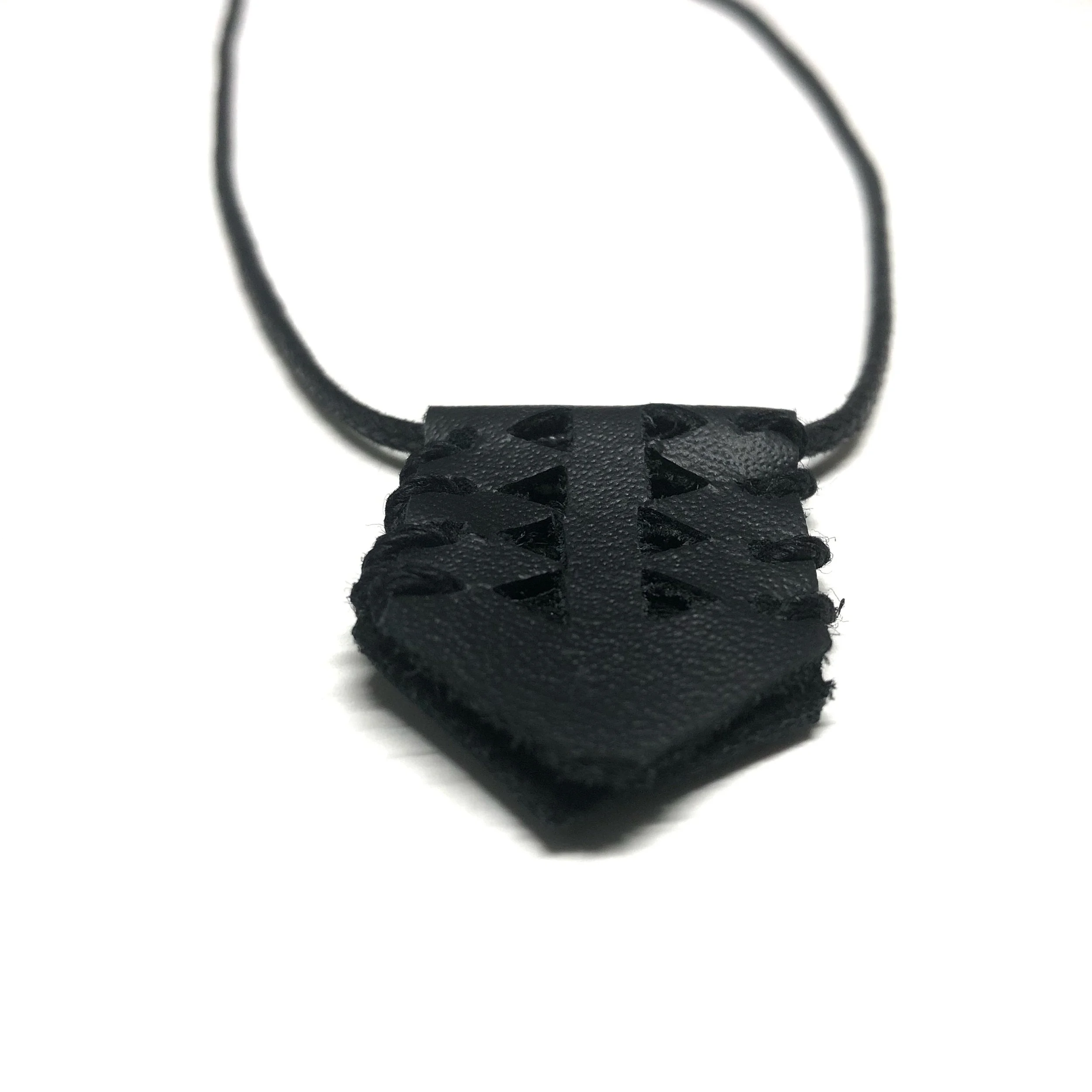 Geometry leather cut-out cord necklace.jpeg