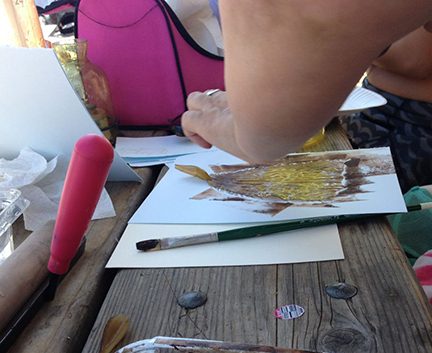 Rolling up the kelp with some ink.