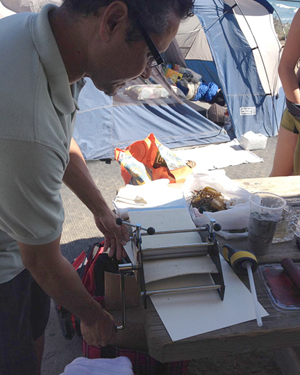 Paul pulling a sand print.