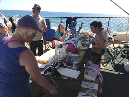 Sandy pulling some prints while lunch is served. Just goes to show you- you don't need a lot of space!