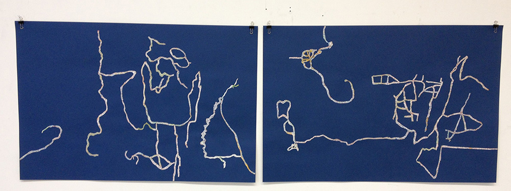 Early in the collage process. Cutting out the roads and attaching them to the paper.