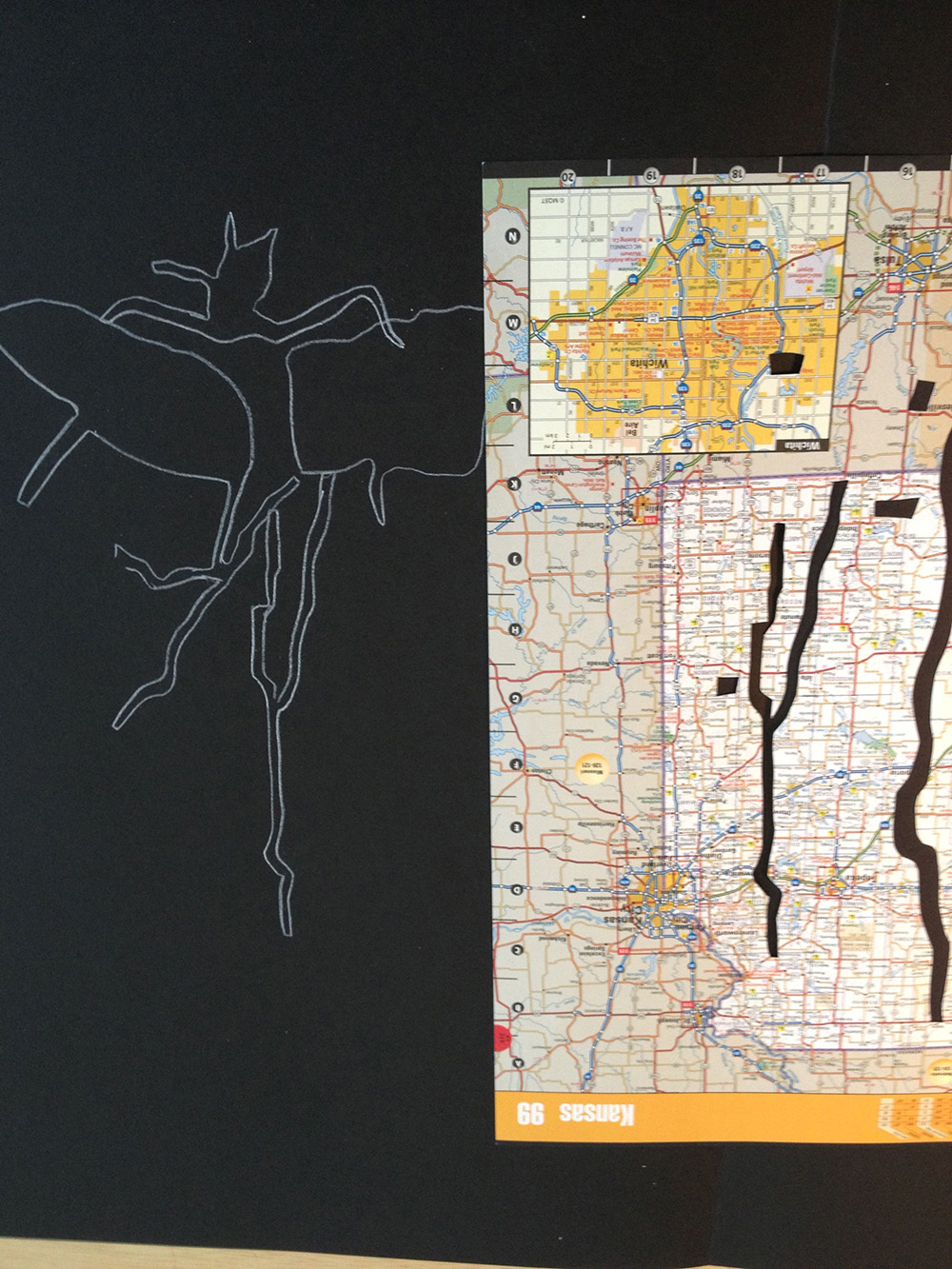 Working on the first Travel Hex drawing by tracing the removed road cut outs from the atlas.