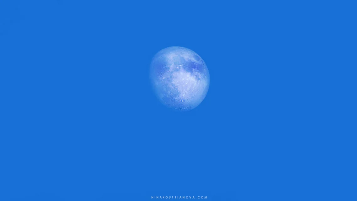 Blue daytime Moon in the Rocky Mountains