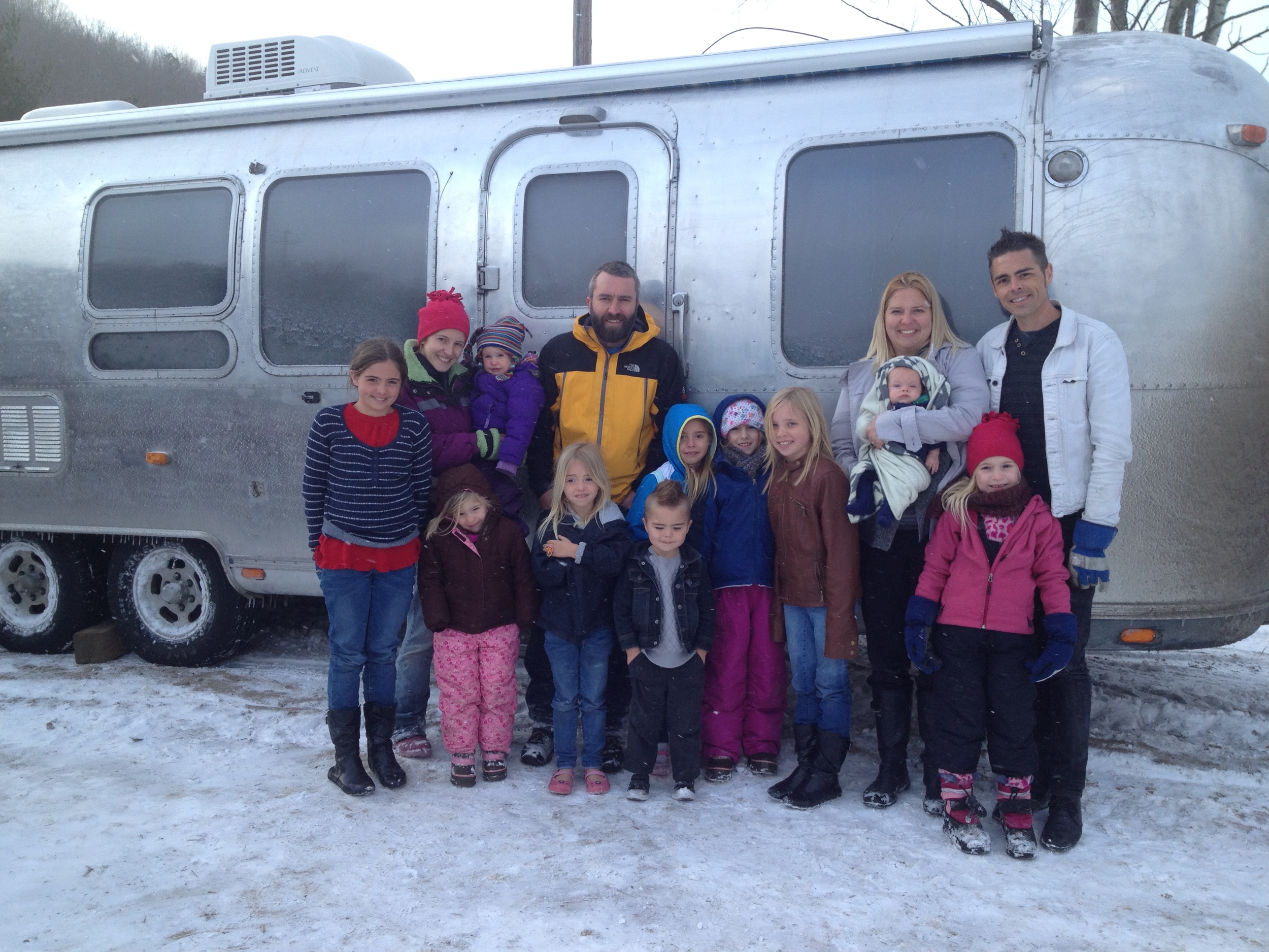 The Mette family with the happy new owners - we're so cold!