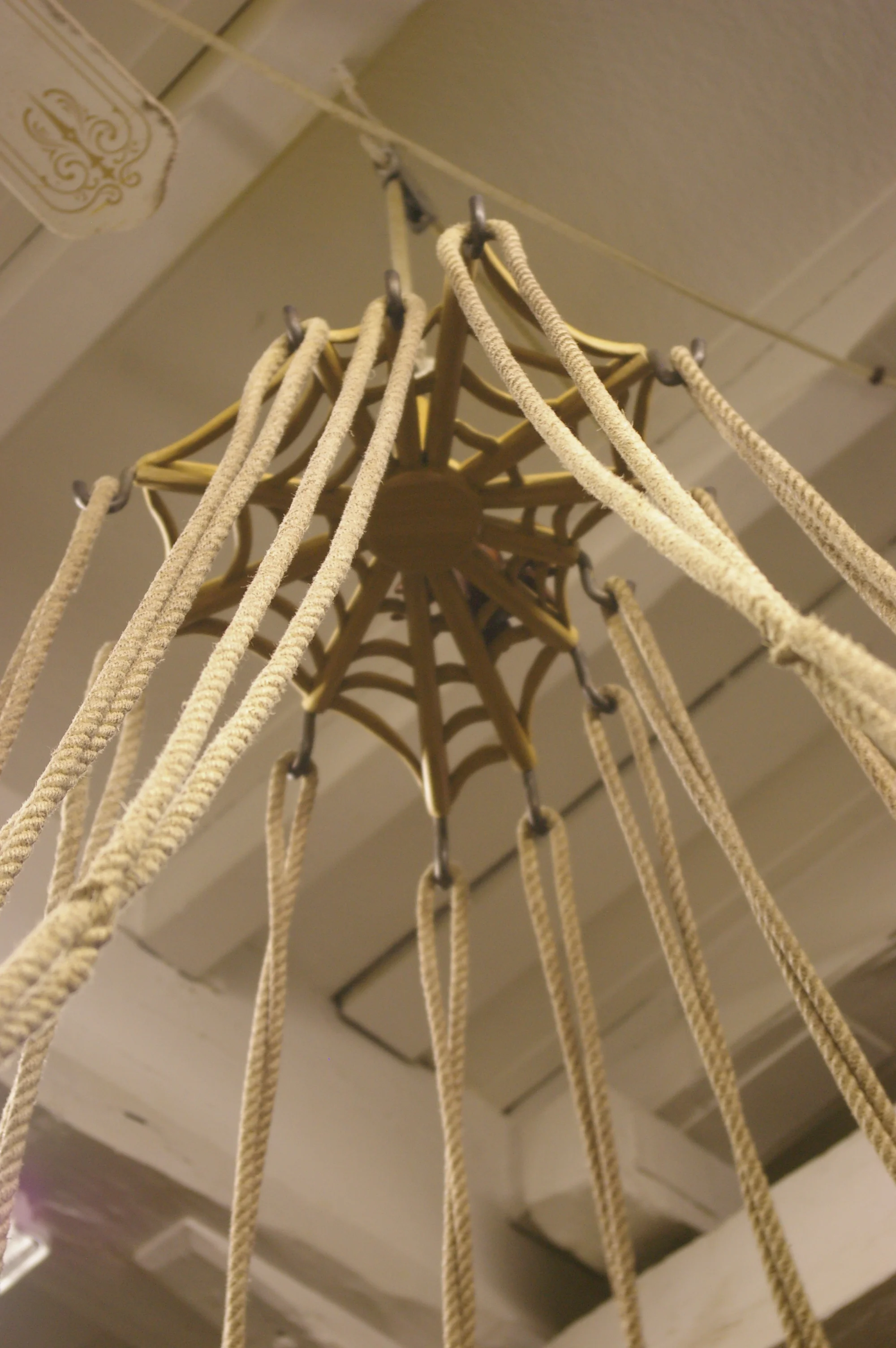 The spider hoisted to the top of the room keeping the bell ropes out of the way.