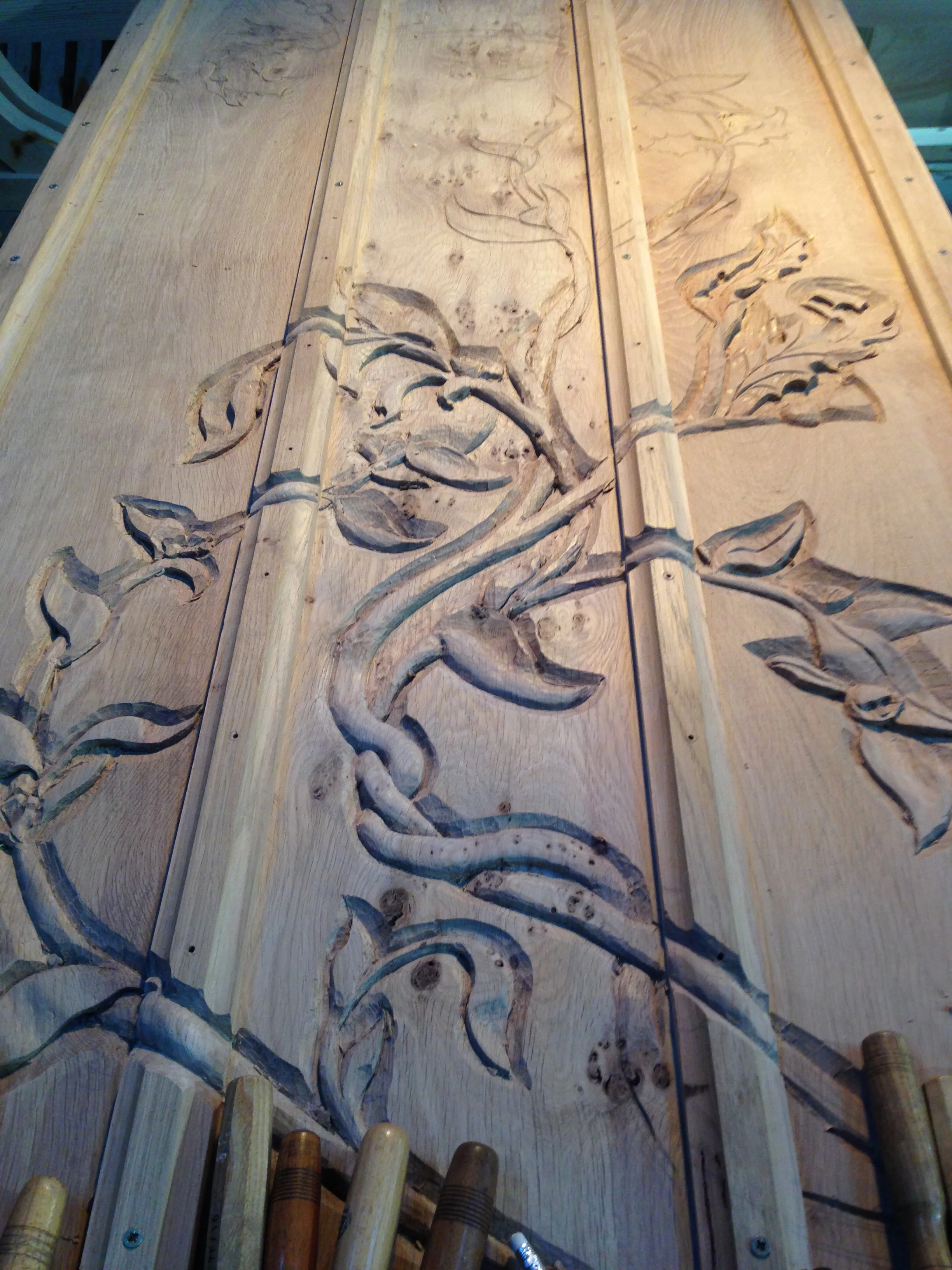 Midway through carving the door