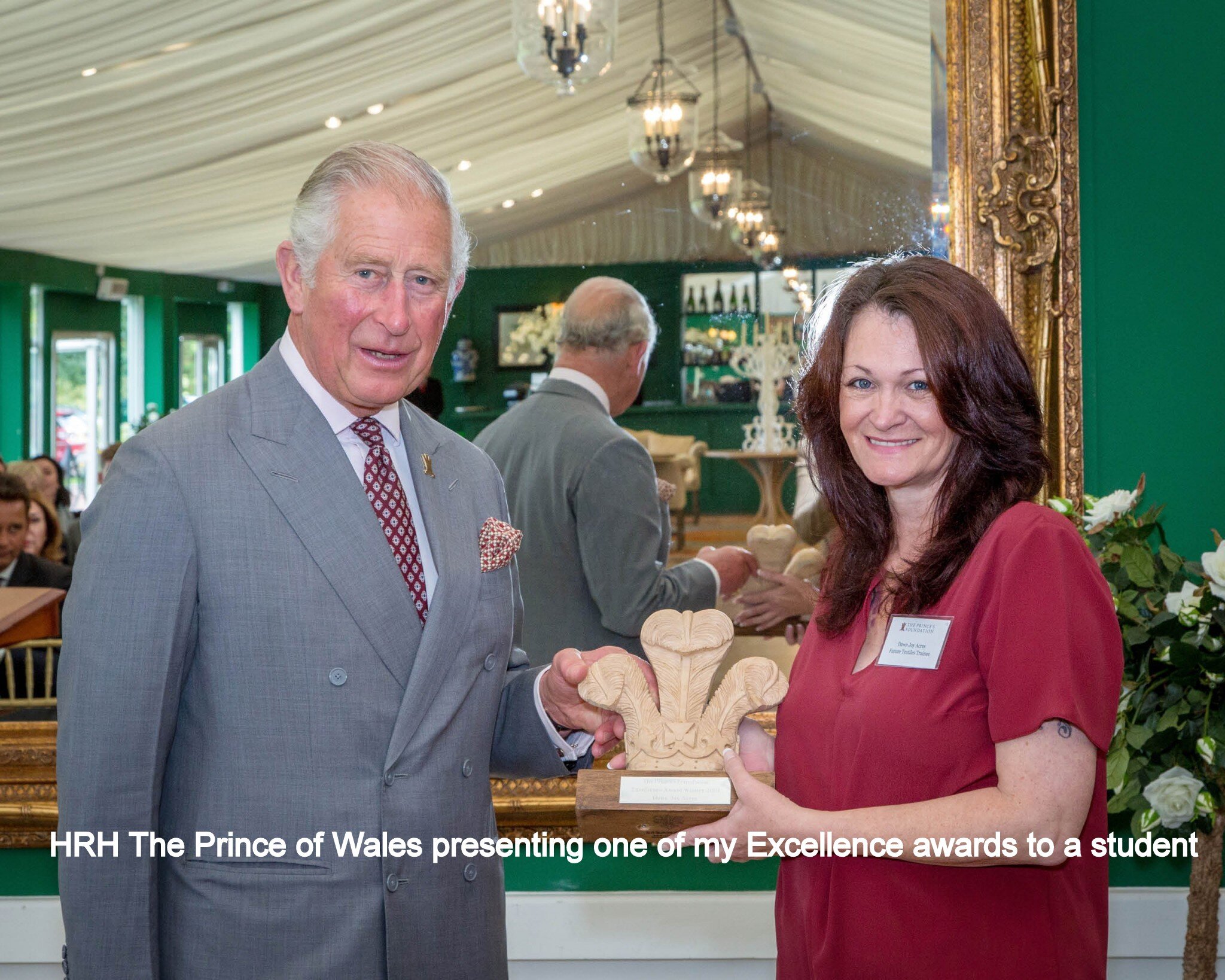 Prince Charles with awards with text.jpg