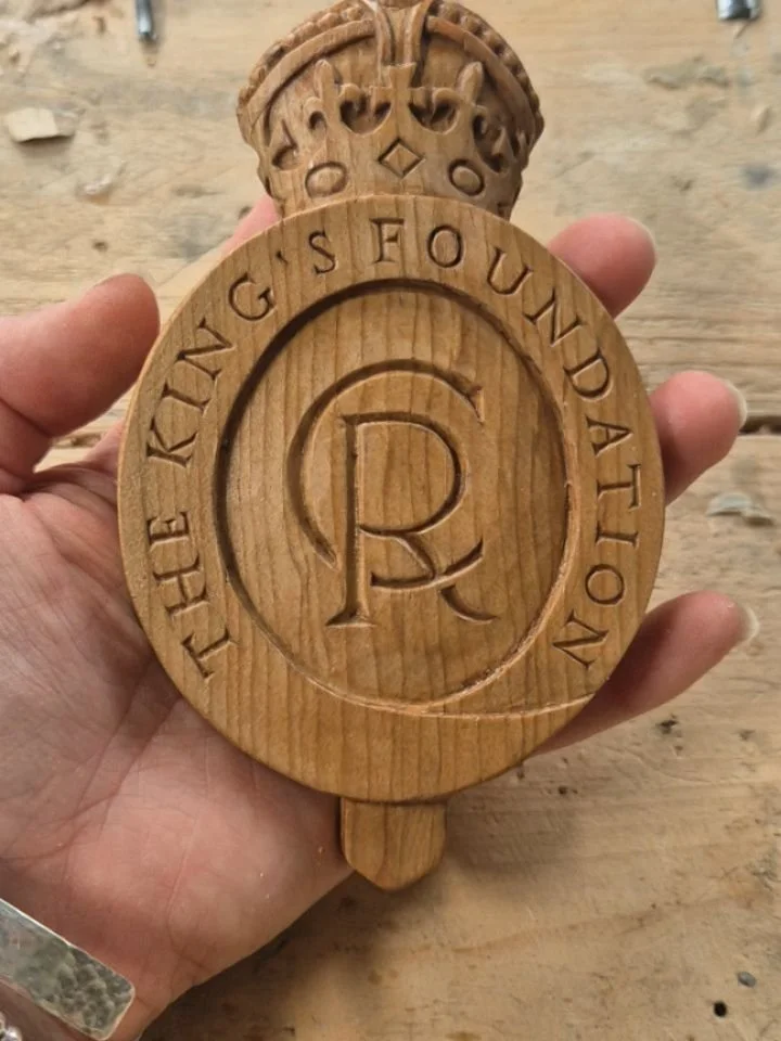 Carved in Cedar taken from the Highgrove estate, these King's Foundation logos are 150mm tall making the writing just 7mm high 😬  I carved 6 before Christmas, now onto another 5! Those mini gouges of mine really came into their own for these 👑 

@k