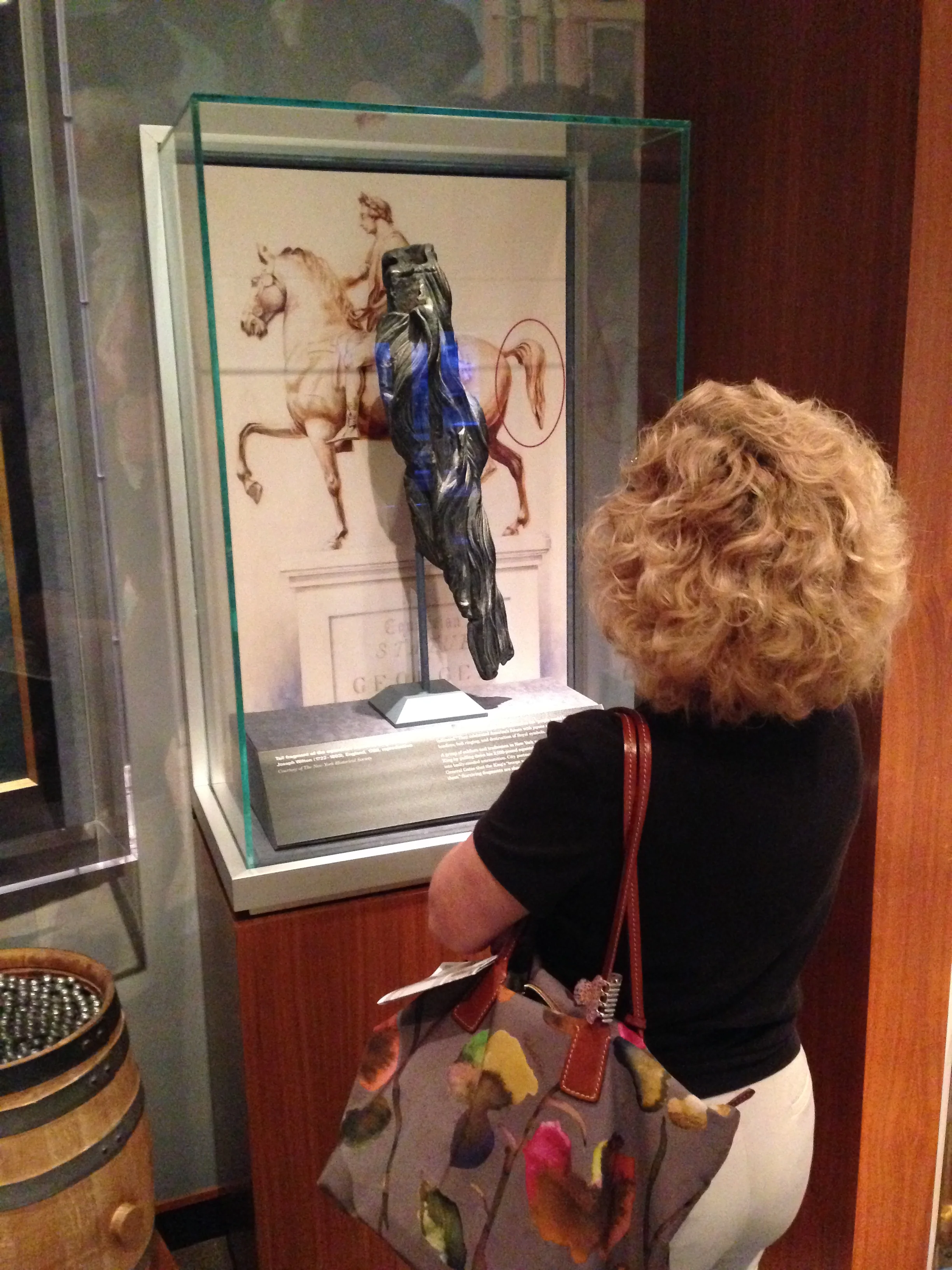 At the Yorktown Victory Center, Mom inspects the tail section from an equestrian statue of King George III which the colonists melted down into bullets.