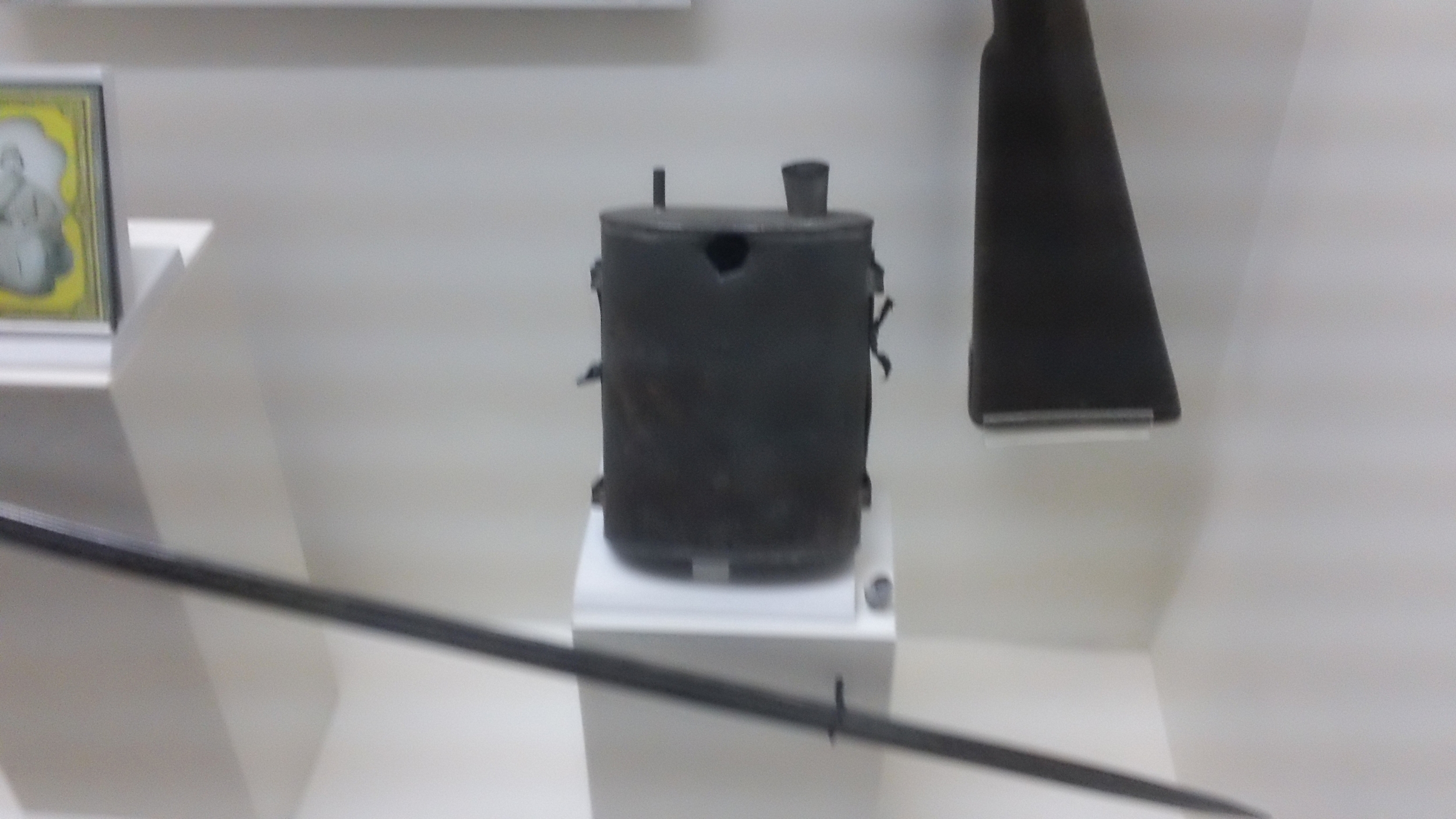 Shot through his canteen, the soldier who wore this died, and his family saved the bullet which you can see at right. 