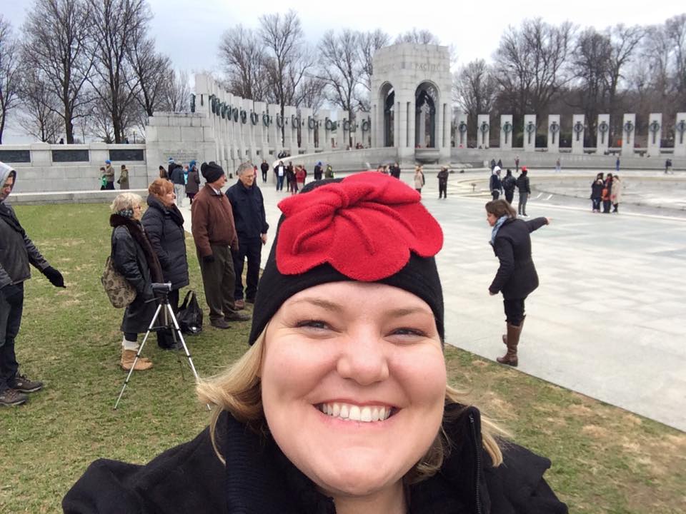  Dianne (our National Archives narrator) takes a selfie with her fellow guides in the background at WWII. What a bright hat!&nbsp; 