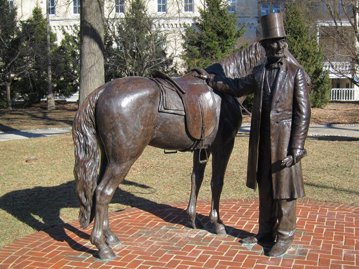 Statue of Lincoln w/his horse Old Bob outside the modern day cottage