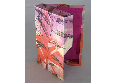 Binder: Catherine Kornel: Box #1 Box with magnetic closure. Paper designed by the binder: tie dyed with monoprint on top. 