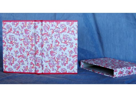C. L. Ingalls, "Blank bookblock is made with hand torn Arches text 120 gsm." Book is covered with imported Italian decorated paper with Oasis leather at the head and tail. Matching decorated paper for headbands. Box of same decorated paper. 6 1/4 x 4 