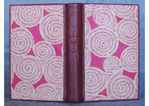 Catherine Kornel, "Poum" by Paul & Victor Margueritte. Half leather binding of Burgundy French Cape Morocco with collaged and stitched Japanese paper designed by binder. Embroidered silk headbands. End Papers are of Japanese handmade paper. 7 1/2 x 5 1/2
