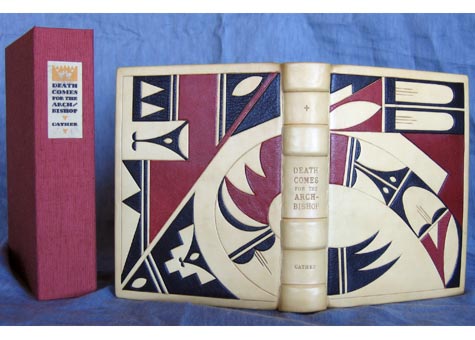  Melinda Padgett, "Death comes for the Archbishop" by Willa Cather. Ivory calf and Morocco onlays with blind tooling. Tight back binding with leather hinge and sewn on vellum. Endpapers are reproduction 1891 New Mexico maps. Asahi covered clamshell b