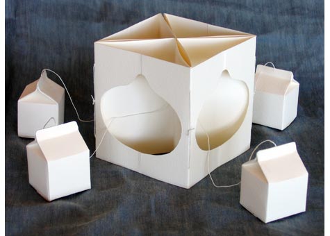 Lyall F. Harris, "Breastfeeding" by Lyall F. Harris, A white paper and string 4 x 4" carousel format plus 4 external elements. 