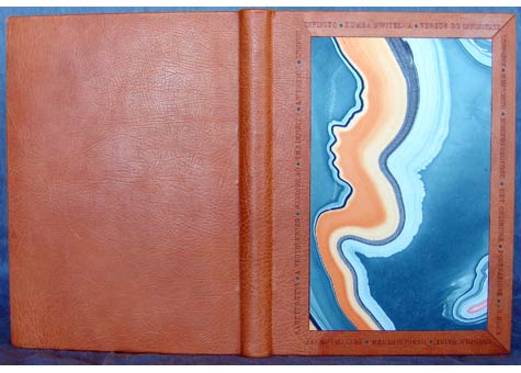  Nysa Wong Kline, "L'Infinito" A selection of translations of Leopardi's poem. Three-quarter binding in orange oasis. Onlays of turquoise calf. Blind-tooled titles in multiple languages frame the vibrant marbled paper to convey the essence of the poe