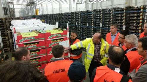 (ABOVE) A warehouse and logistics manager walks though the operation 