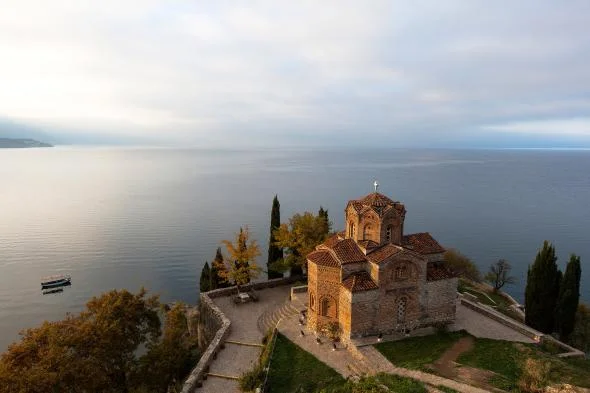 The Church of Saint John at Kaneo overlooks the calm waters of Lake Ohrid. PHOTOGRAPH BY PASCAL MEUNIER, REDUX