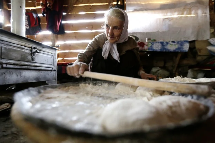 A woman in Bosnia and Herzegovina makes traditional bread - Elma Okic