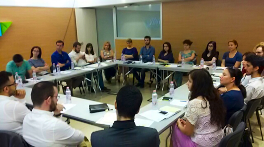 ABOVE: Roundtable discussions engage participants in a lively discussion of material they just learned