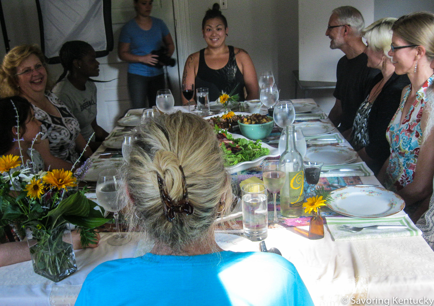 Friends prepare to enjoy a Classic Kentucky Meal, with Sarah Jane Sanders photographing it all.