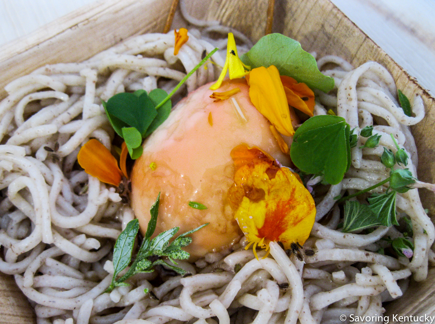 Bluegrass Banchan: Middle Fork Kitchen Chef Mark Jensen's sassafras smoked farm egg atop cold kansui noodle, with assorted fresh pickles, not shown
