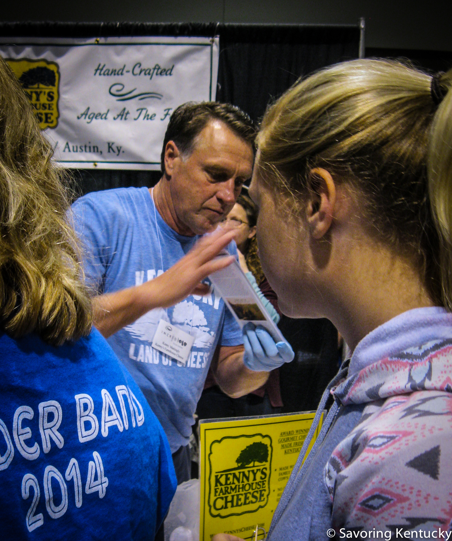 Kenny Mattingly, center, of Kenny's Farmhouse Cheese , meeting customers at the 2014 Kentucky Proud Incredible Food Show , Lexington, Kentucky