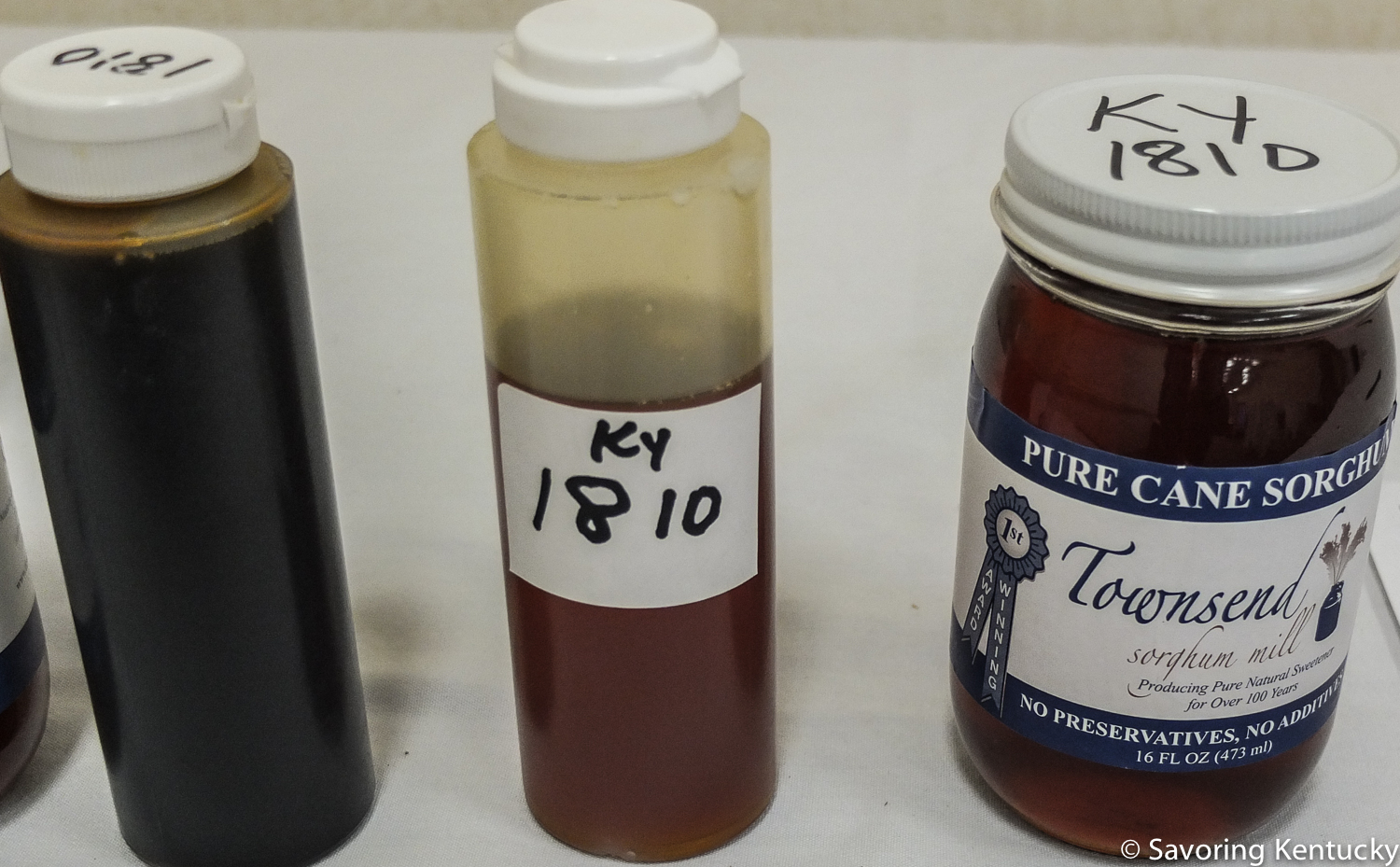 1810 variety sorghum made in Woodford County, Kentucky, at Country Rock Sorghum (left) contrasts in color, texture, and flavor from 1810 variety sorghum made in Montgomery County, Kentucky, at Townsend Sorghum Mill (center and right.)
