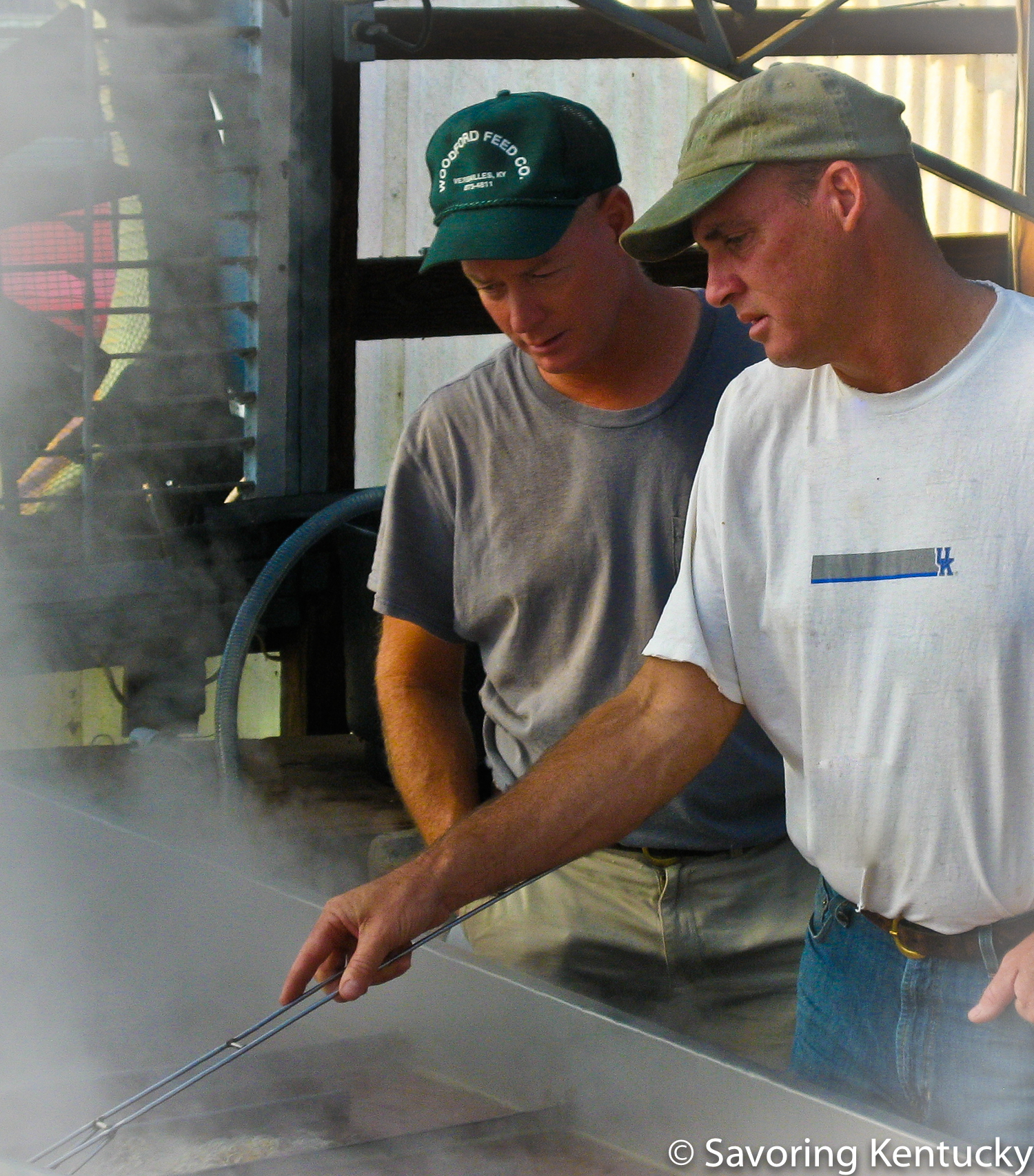Curtis Congleton, left, and Randal Rock cook Country Rock Sorghum