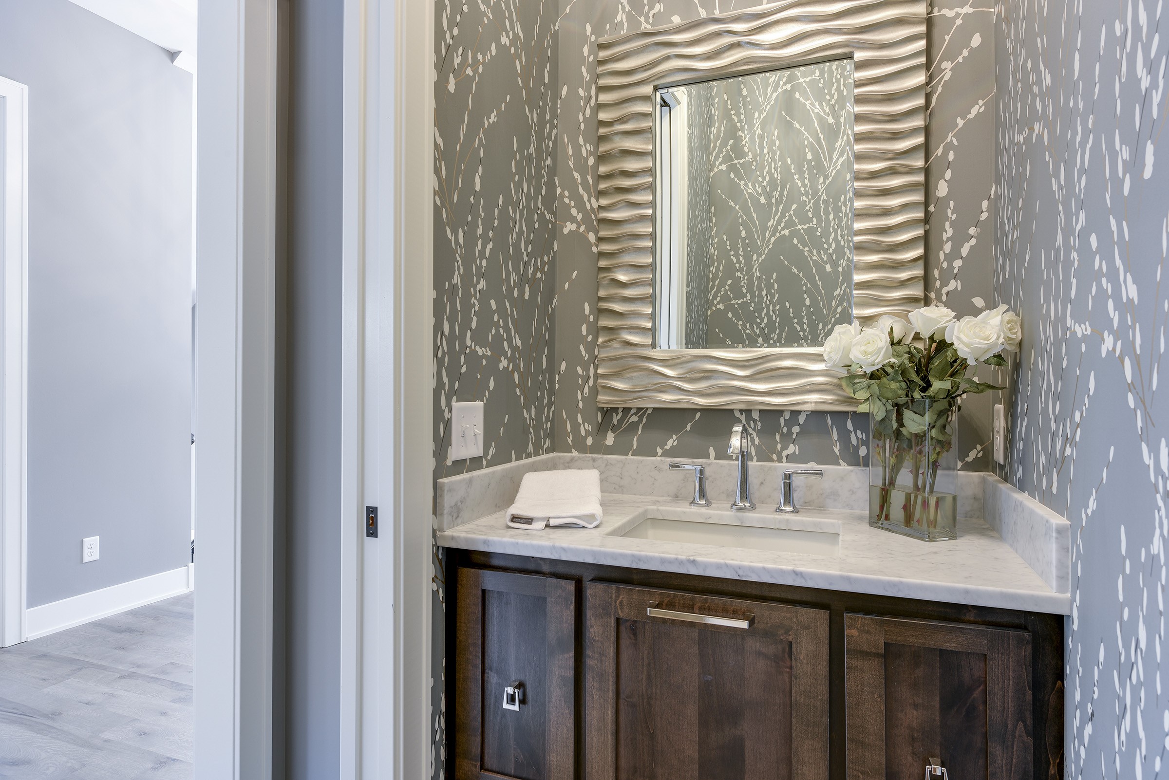 Wallpaper in a small space is really eye catching.