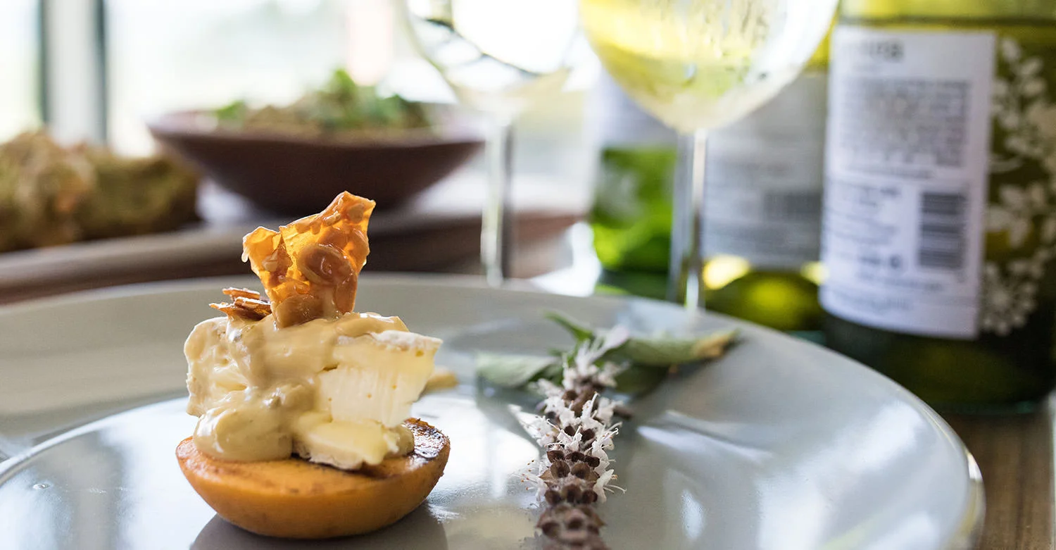 Grilled Peach with Camembert, Caesar Dressing and Nut Brittle