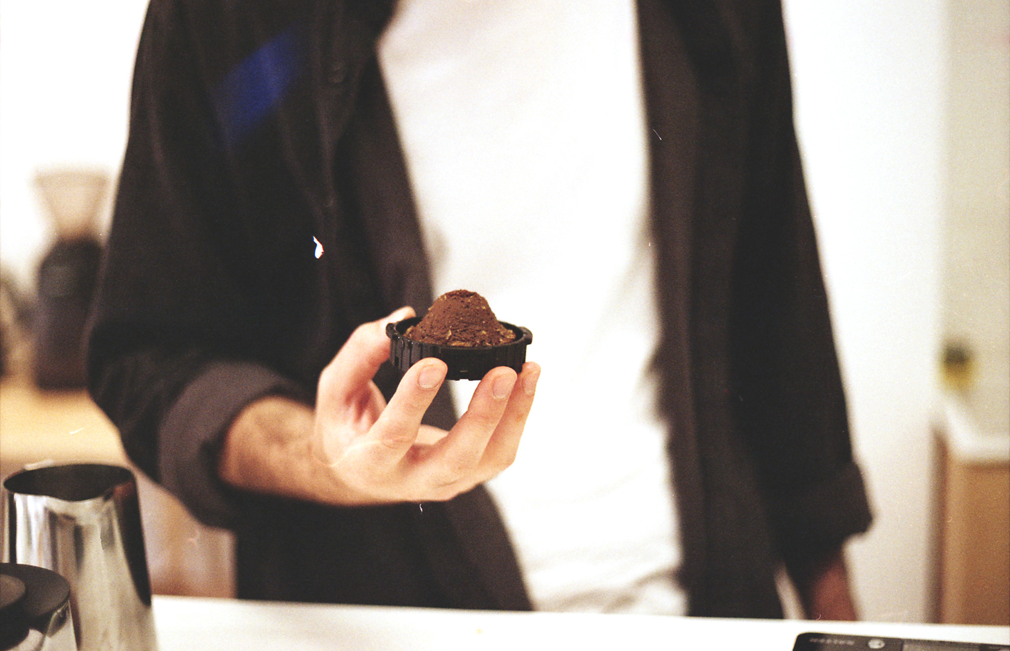Coffee grounds formed into a perfect cone using aeropress — a sign of a true master of the craft.