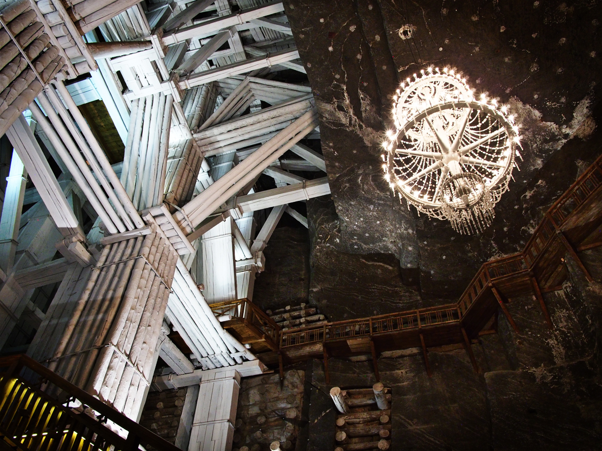 The mine is supported throughout with heavy wood beams. The beams become impregnated with salt and eventually petrify. These wood beams are coated in salt. The chandelier in this image is made of salt. Salt. Salt. Salt. Everything salt. Oh, and yes, you can lick the walls.