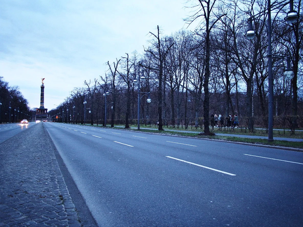 Students walk toward the Franko-Prussian War Memorial in Berlin, Germany.