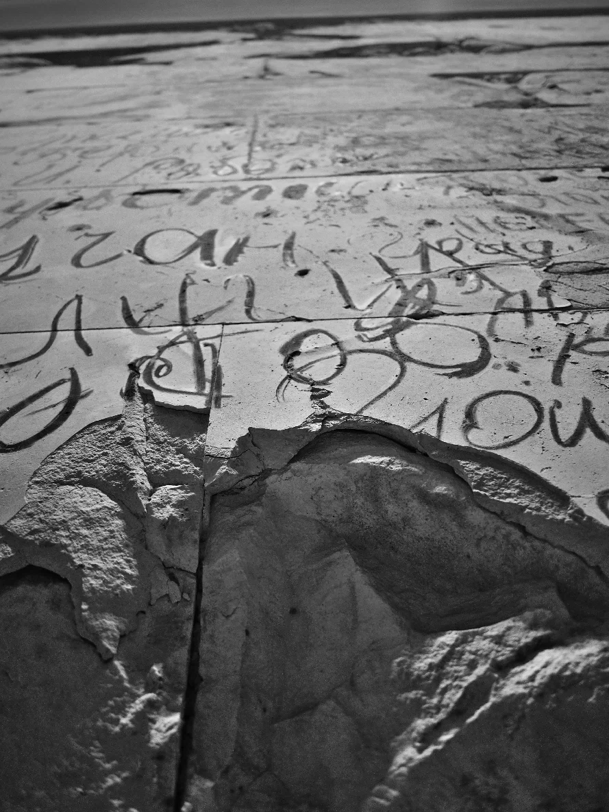 A wall of the Reichstag inside of the Bundestag - covered with charcoal graffiti by Russian solders after the Battle of Berlin.