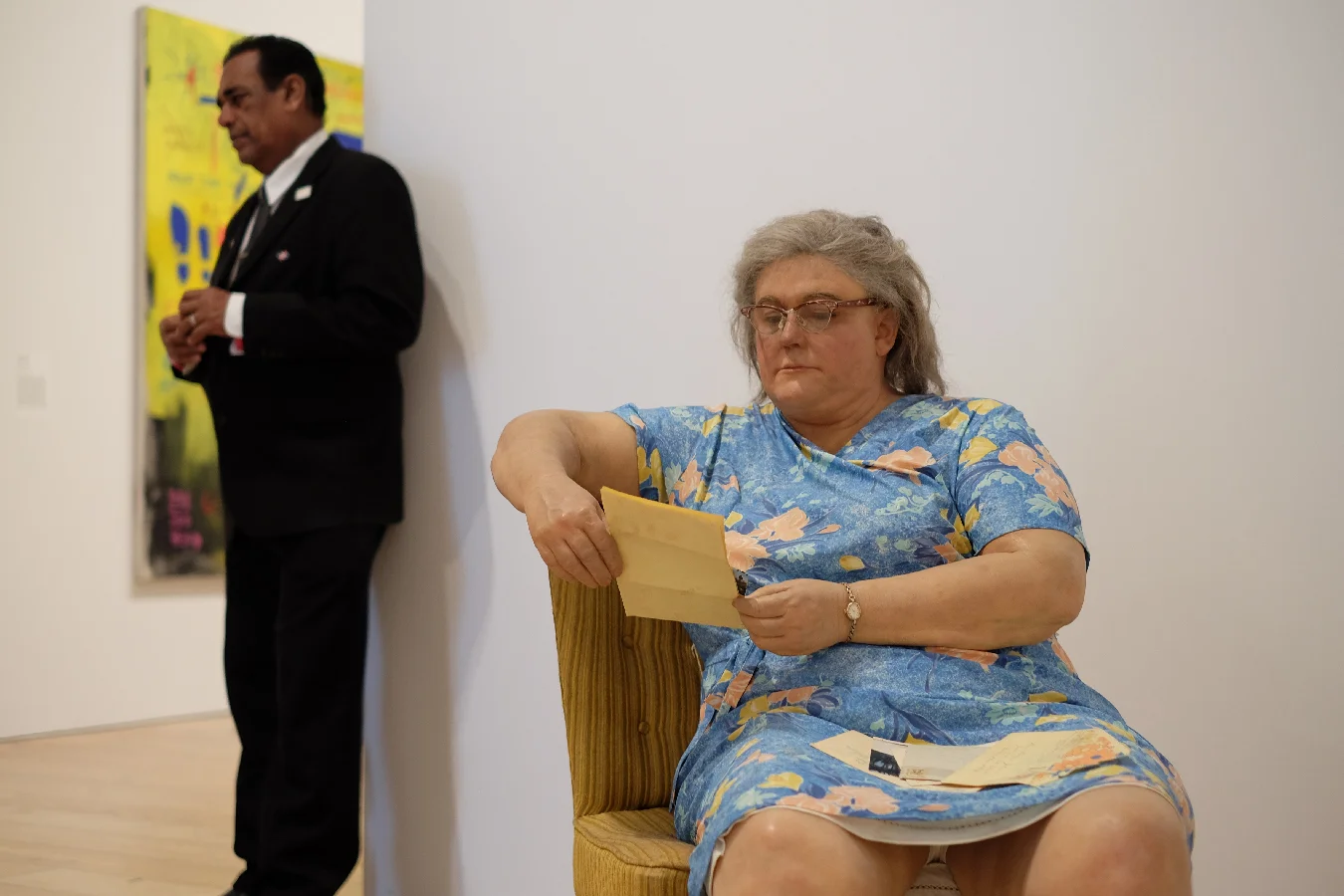 One of these is a sculpture. Amazing realism by Duane Hanson.