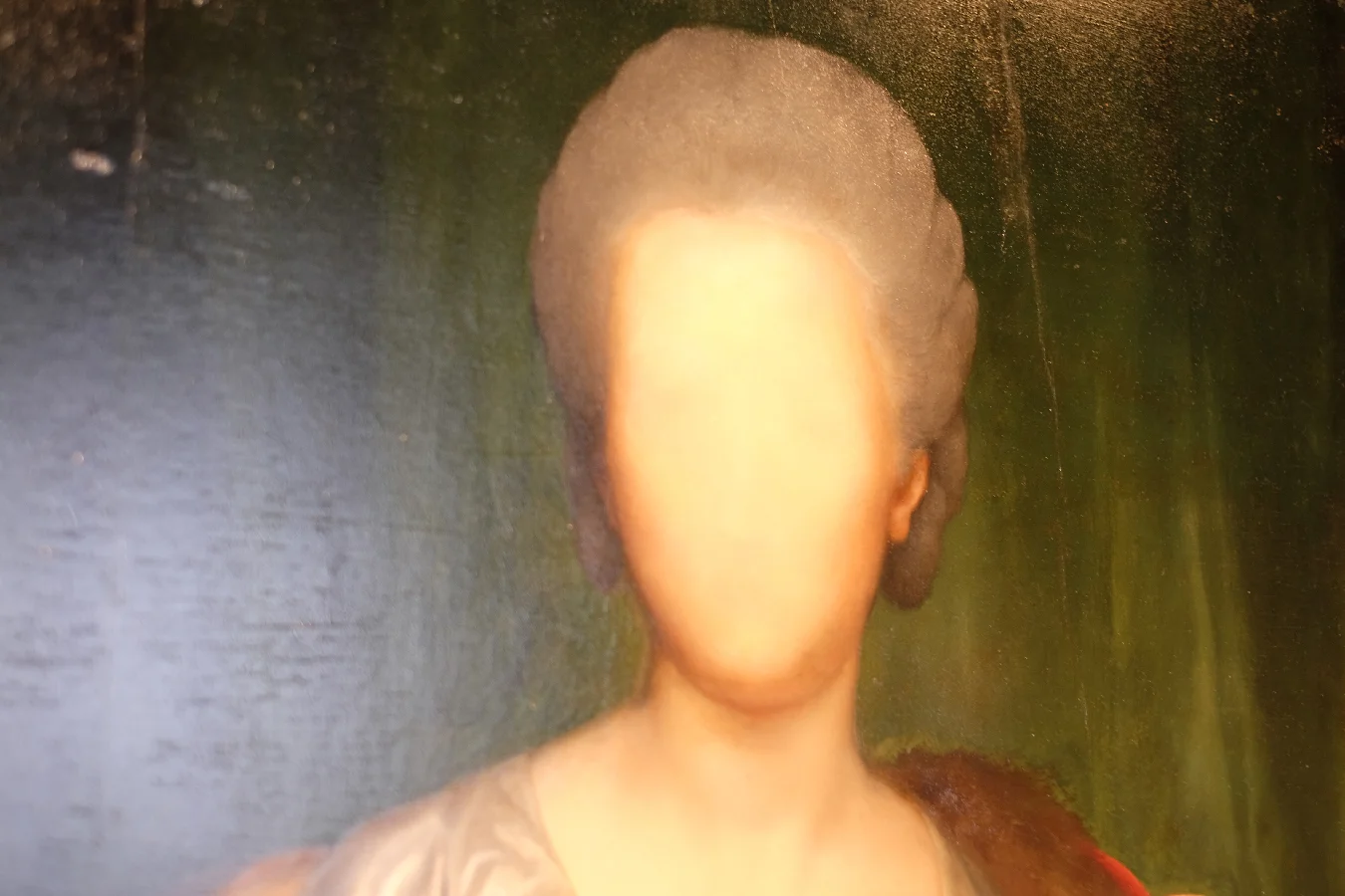 An unfinished portrait with an erased face.