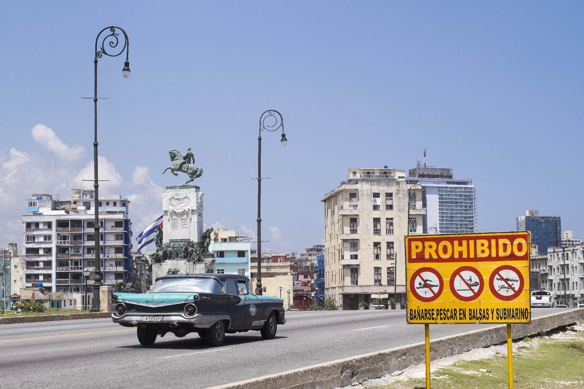 Walking along Malécon on a sweltering hot day. 1959 or 2019?