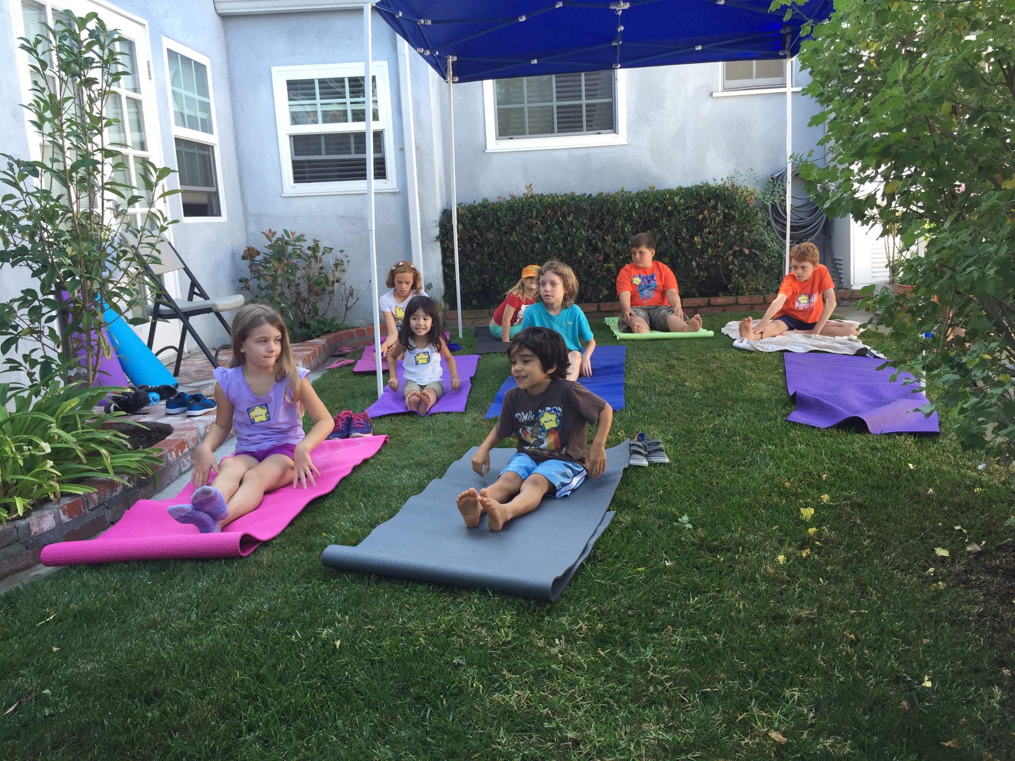 Kids having fun learning yoga at the Pop Up - Iyashi Wellness Kids event in 2015