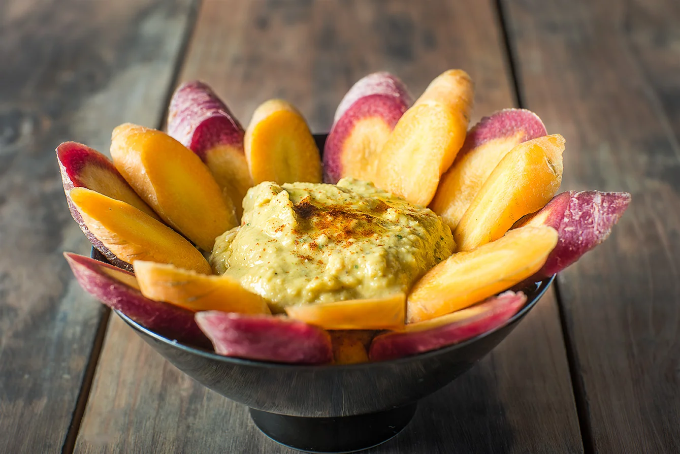 Hummus with sliced Multi-colored organic carrots